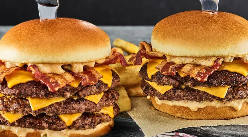 a triple cheeseburger and a double cheeseburger